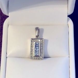 14K White gold, diamond, and tanzanite bar style rectangular pendant.